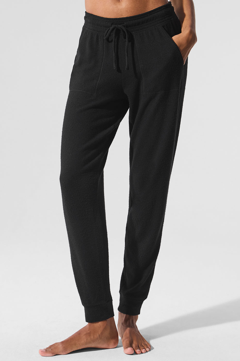 Close-up of the soft fabric texture on grey sweatpants