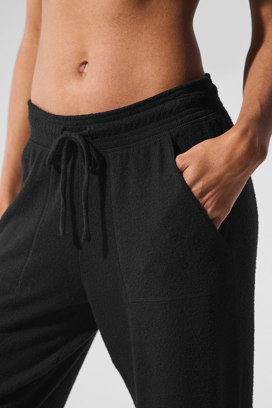 Close-up of the soft fabric texture on grey sweatpants