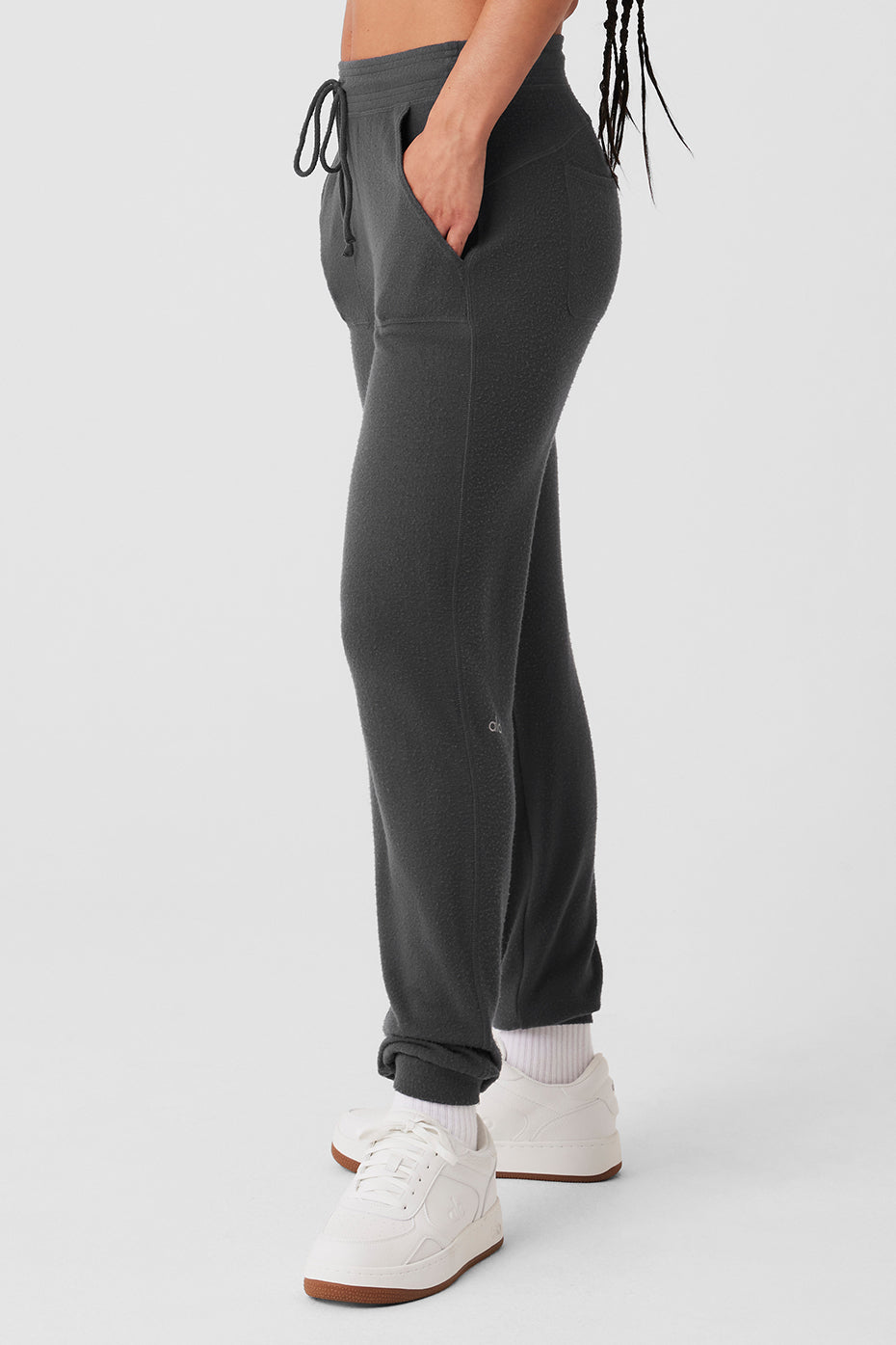 Side view of mens cashmere sweatpants, highlighting the soft fabric and patch pockets.
