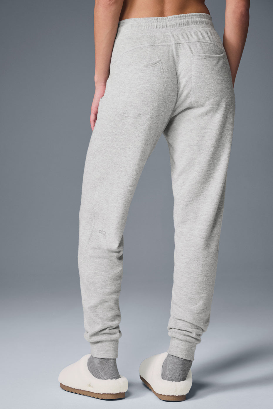 Back view showing drape of baggy sweatpants during movement