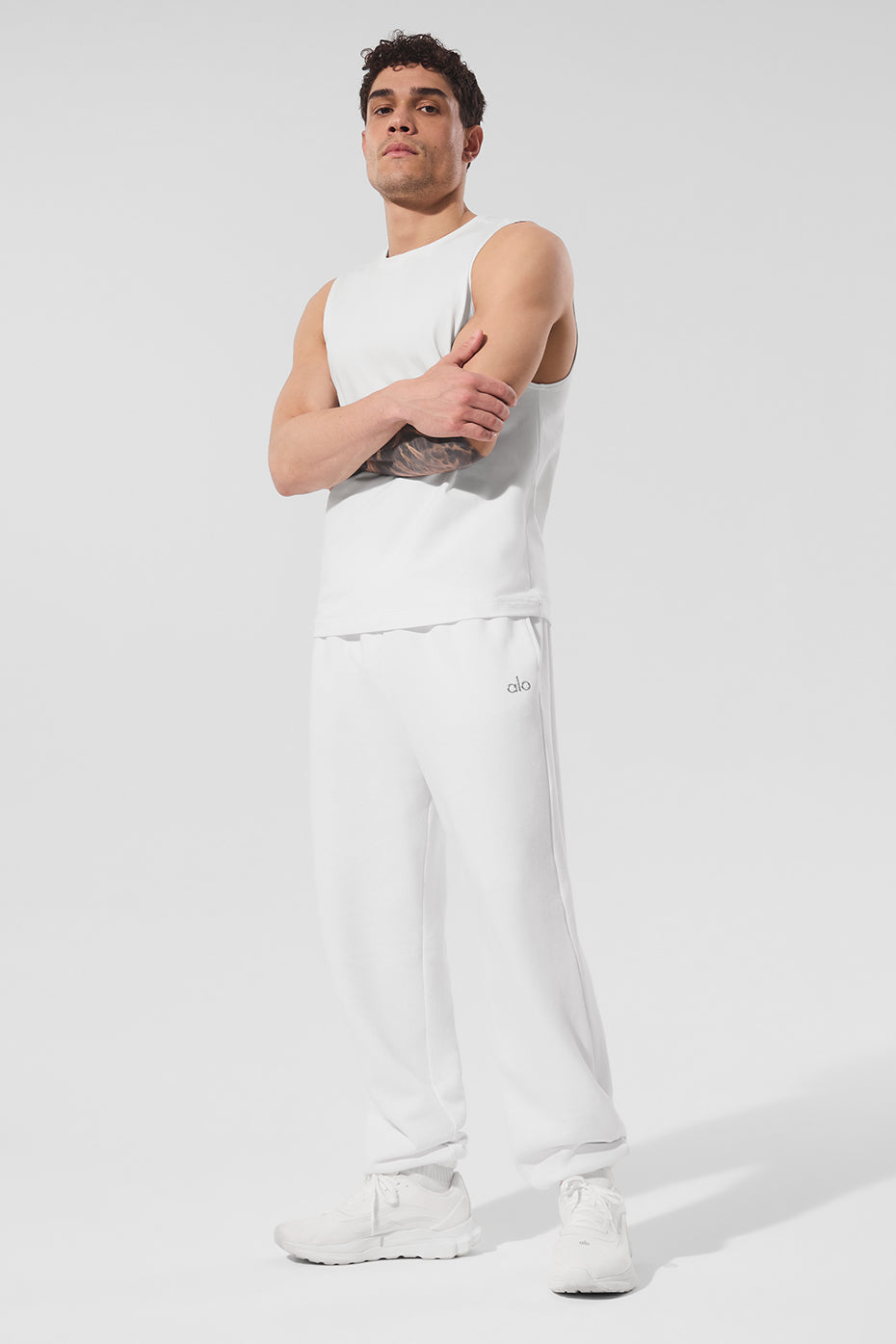 Man in baggy sweatpants enjoying a relaxed day outdoors.
