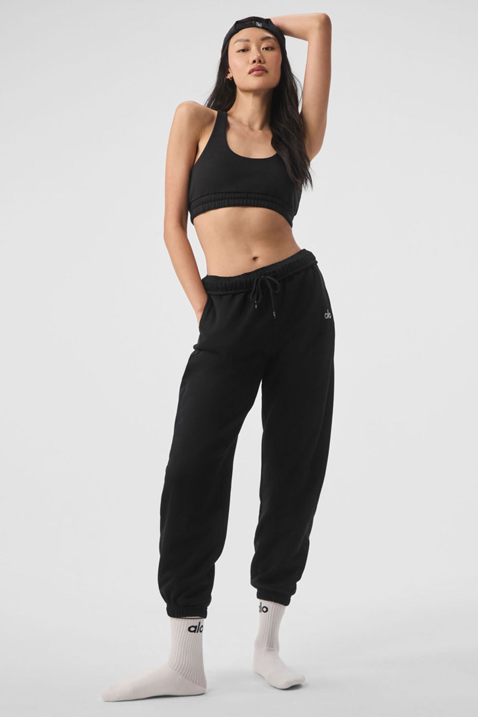 Front view of black sweatpants with relaxed fit, perfect for athleisure wear