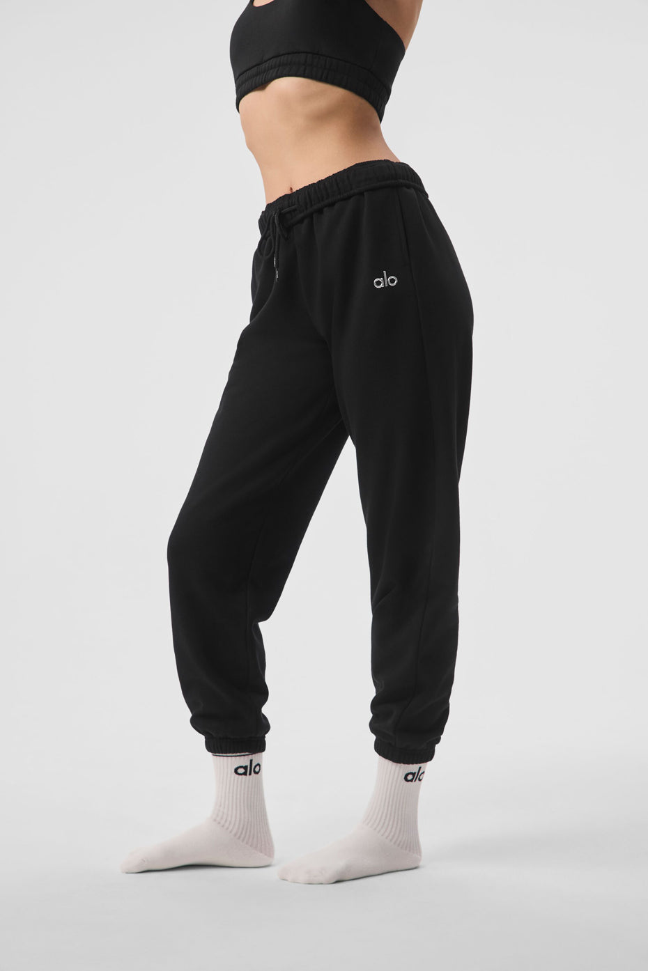 Close-up of elastic waistband and cuffs on black sweatpants
