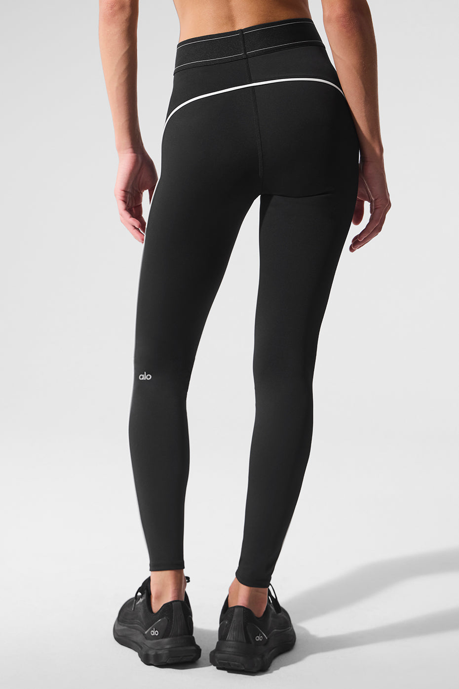 Close-up of waistband detail on alo yoga leggings showing sculpted compression fit