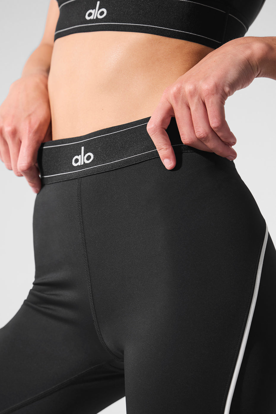Full-body view of compression sleeves for legs with sleek piping against white background