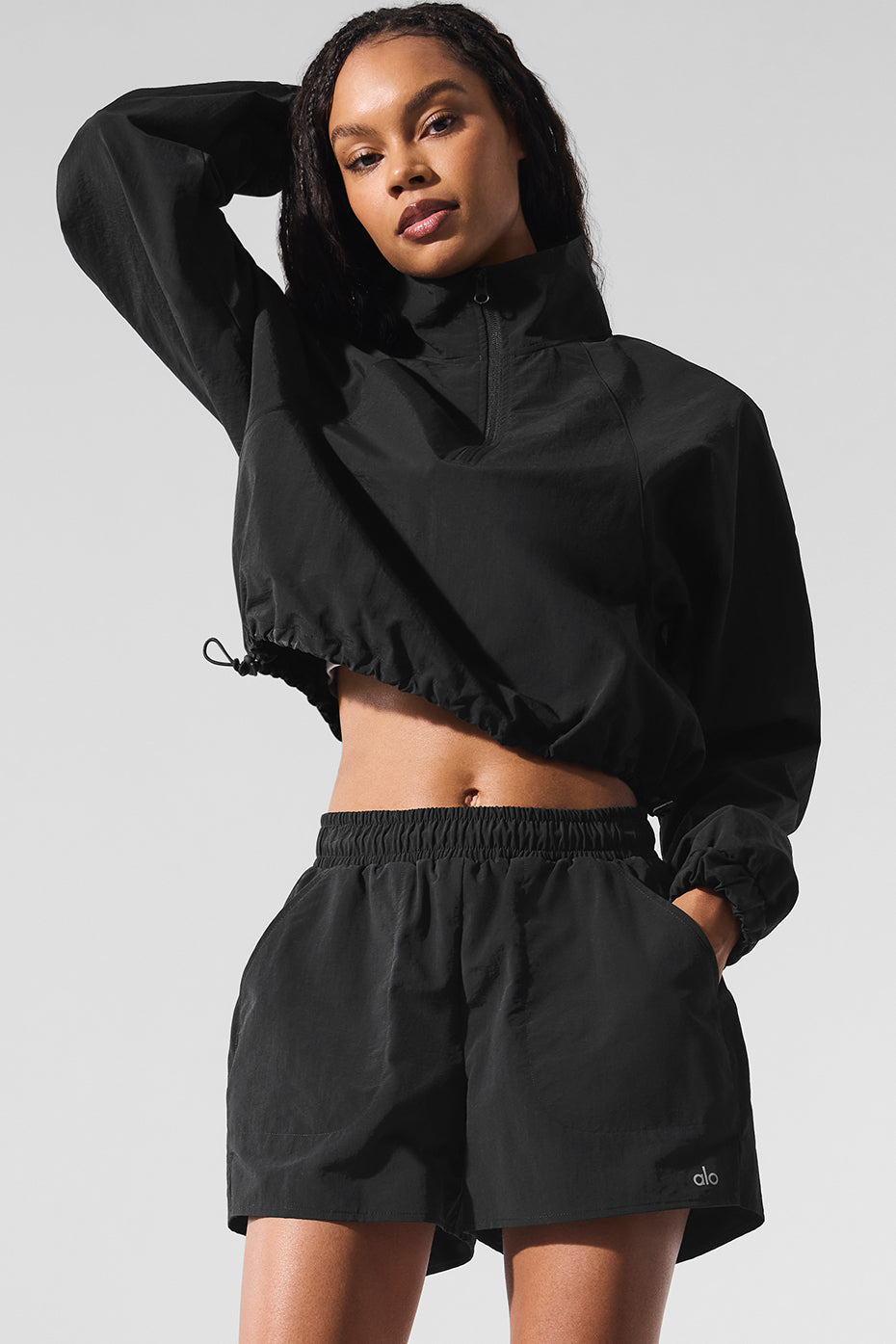 Close-up of the side pocket detail on black workout shorts