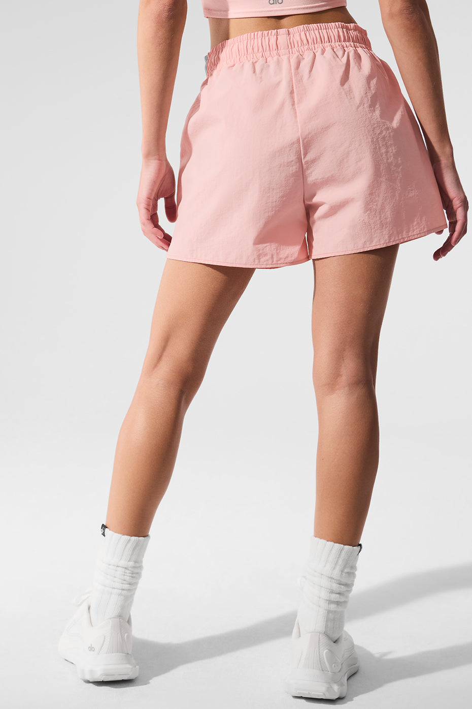 Side view of high-waisted sports shorts during a hike.