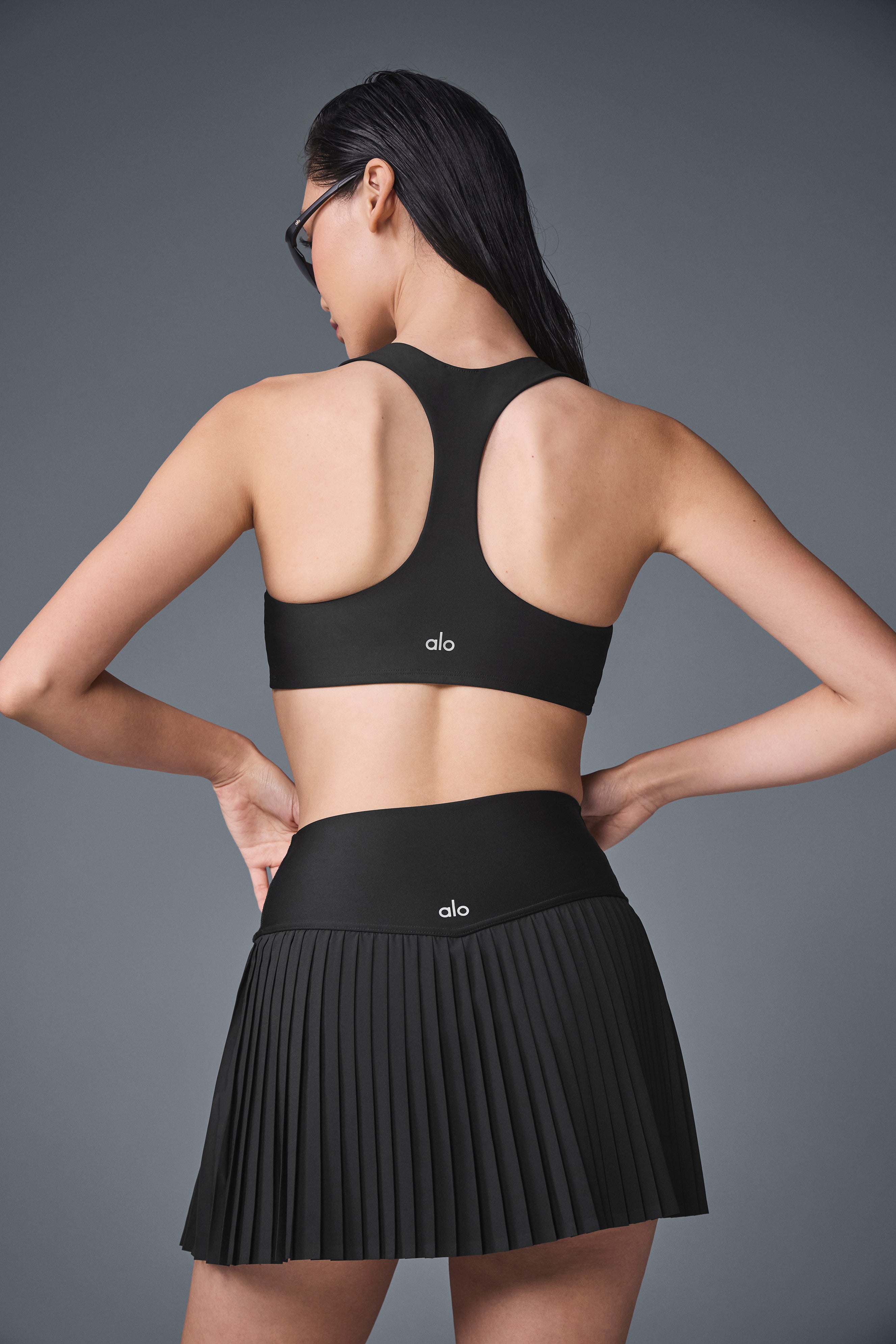 Close-up of the high-rise waistband of the black tennis skirt.