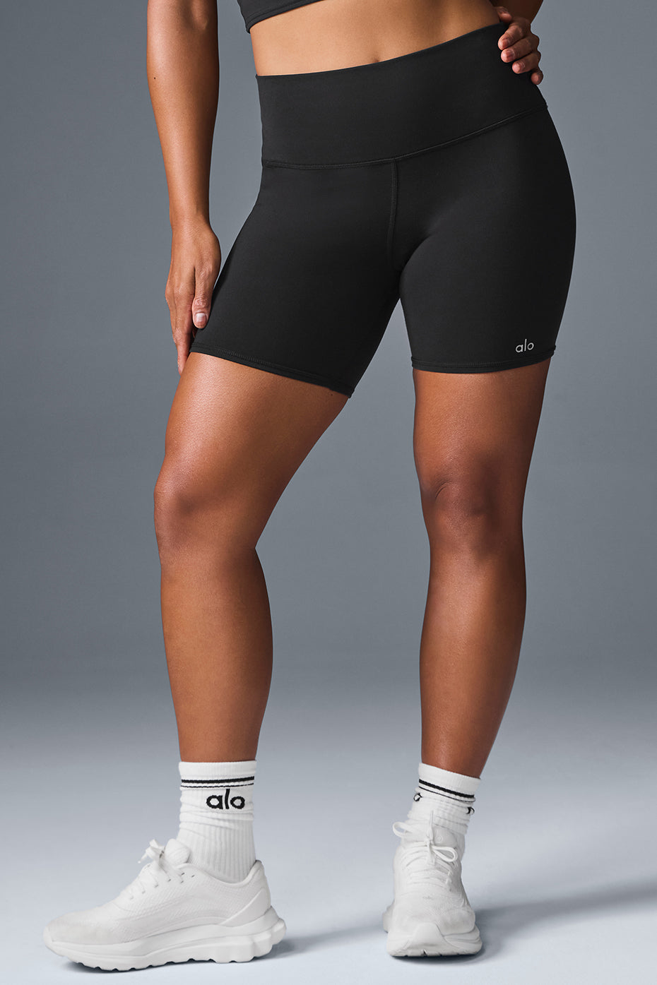 Side view of sculpting shorts women wear for workouts, showing high-waist fit and stretch fabric