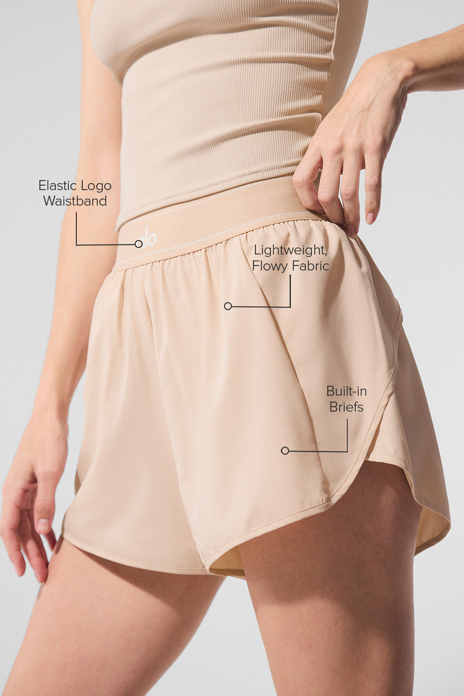 Side angle of performance shorts with an elastic waistband, ideal for tennis.