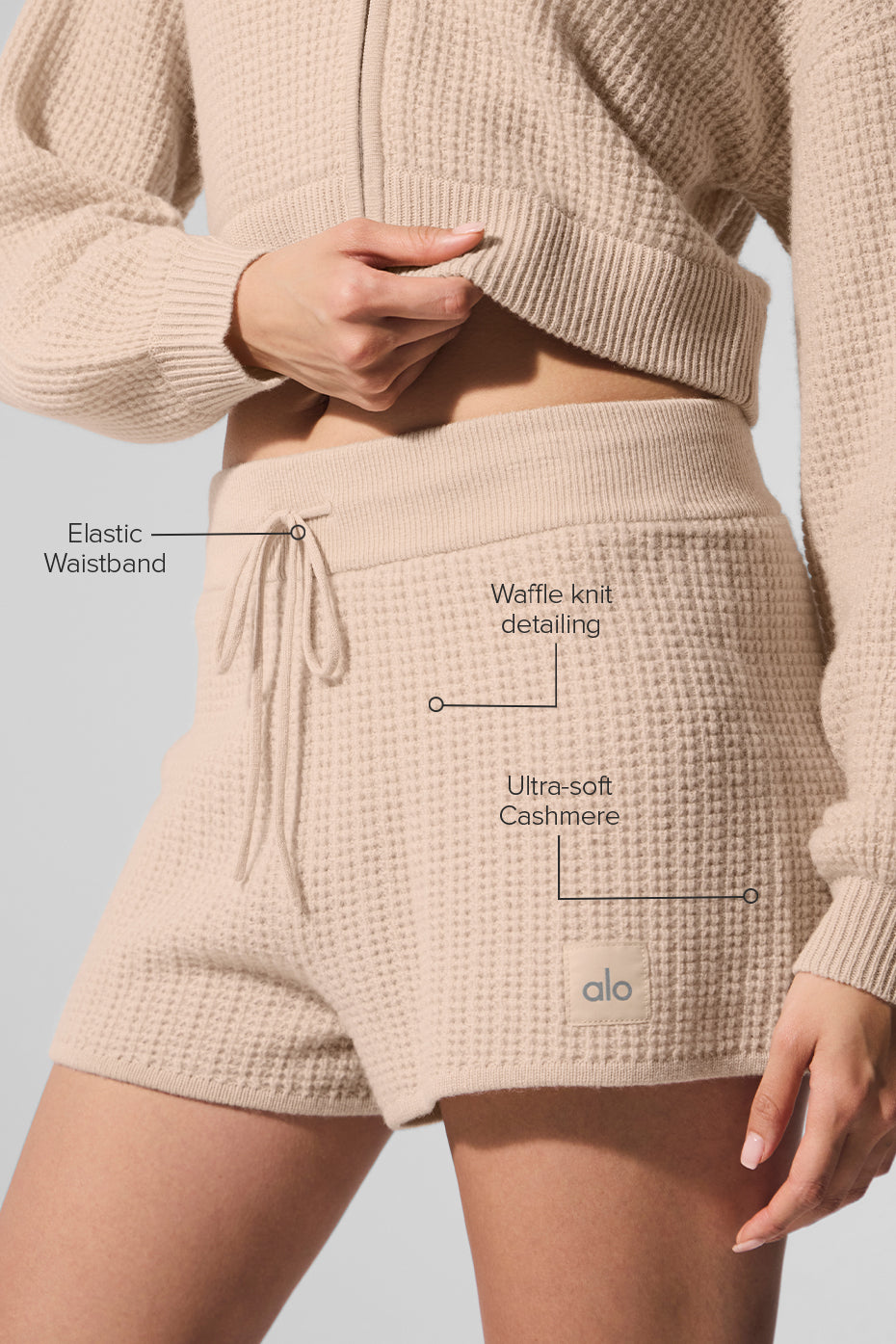 Close-up of the ultra-soft cashmere fabric in high-waist shorts.