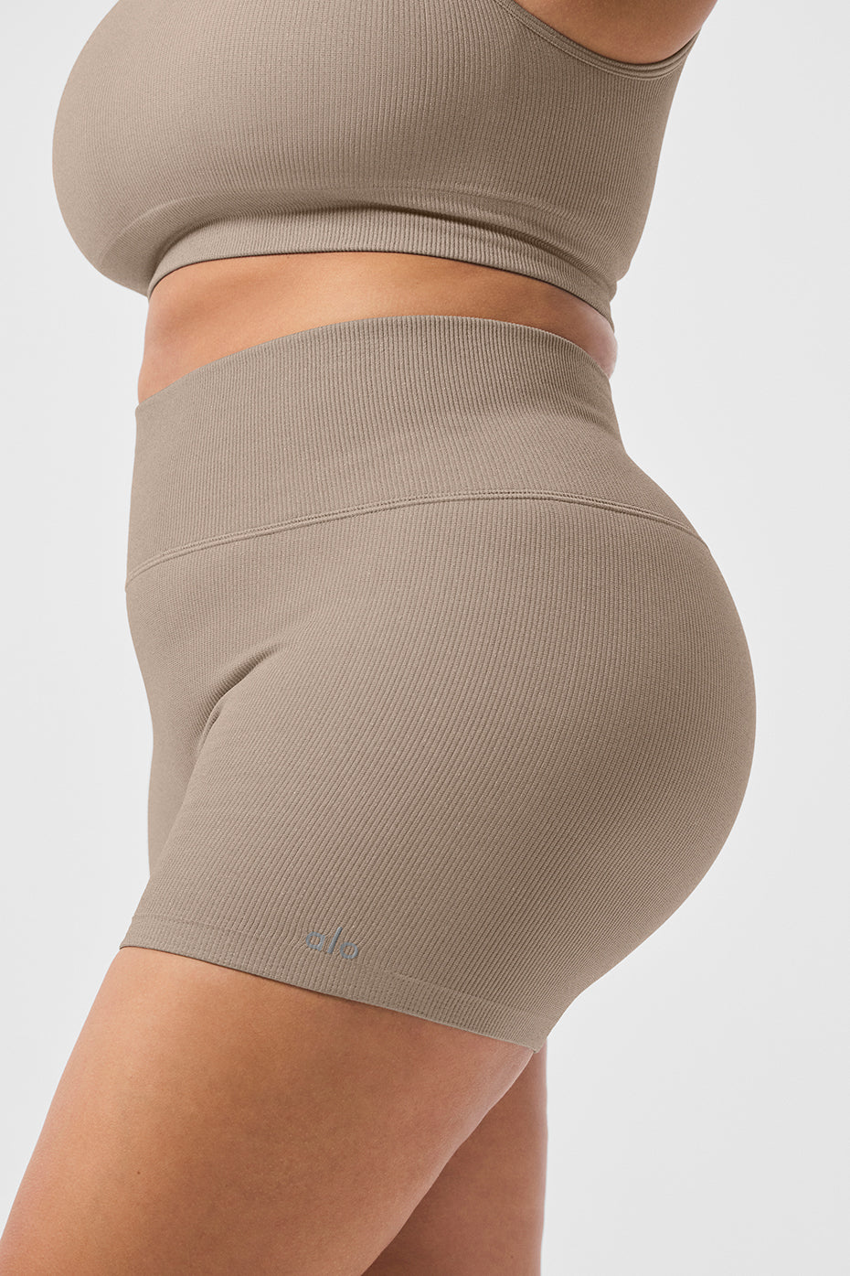 Back view showcasing the high rise design of shimmer shorts