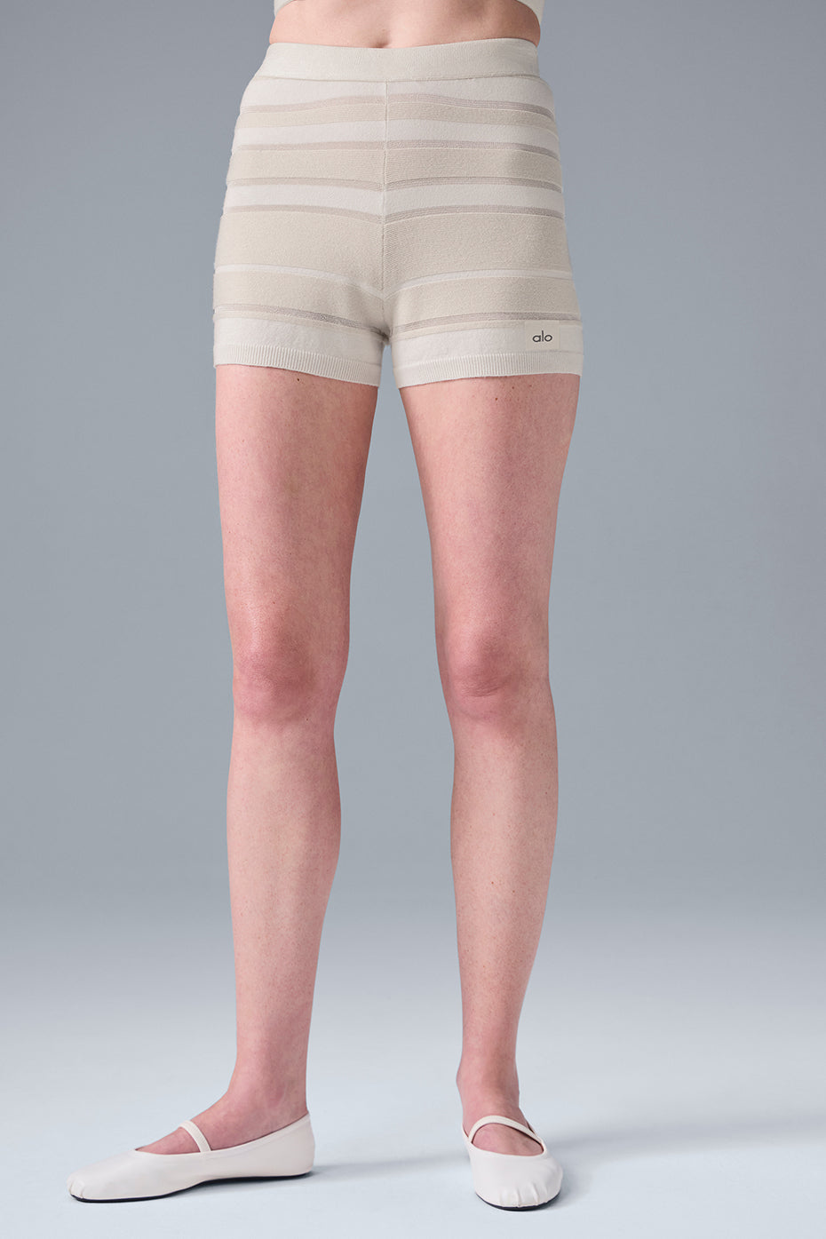 Front view of ivory knit lounge shorts with shimmer finish and high waist