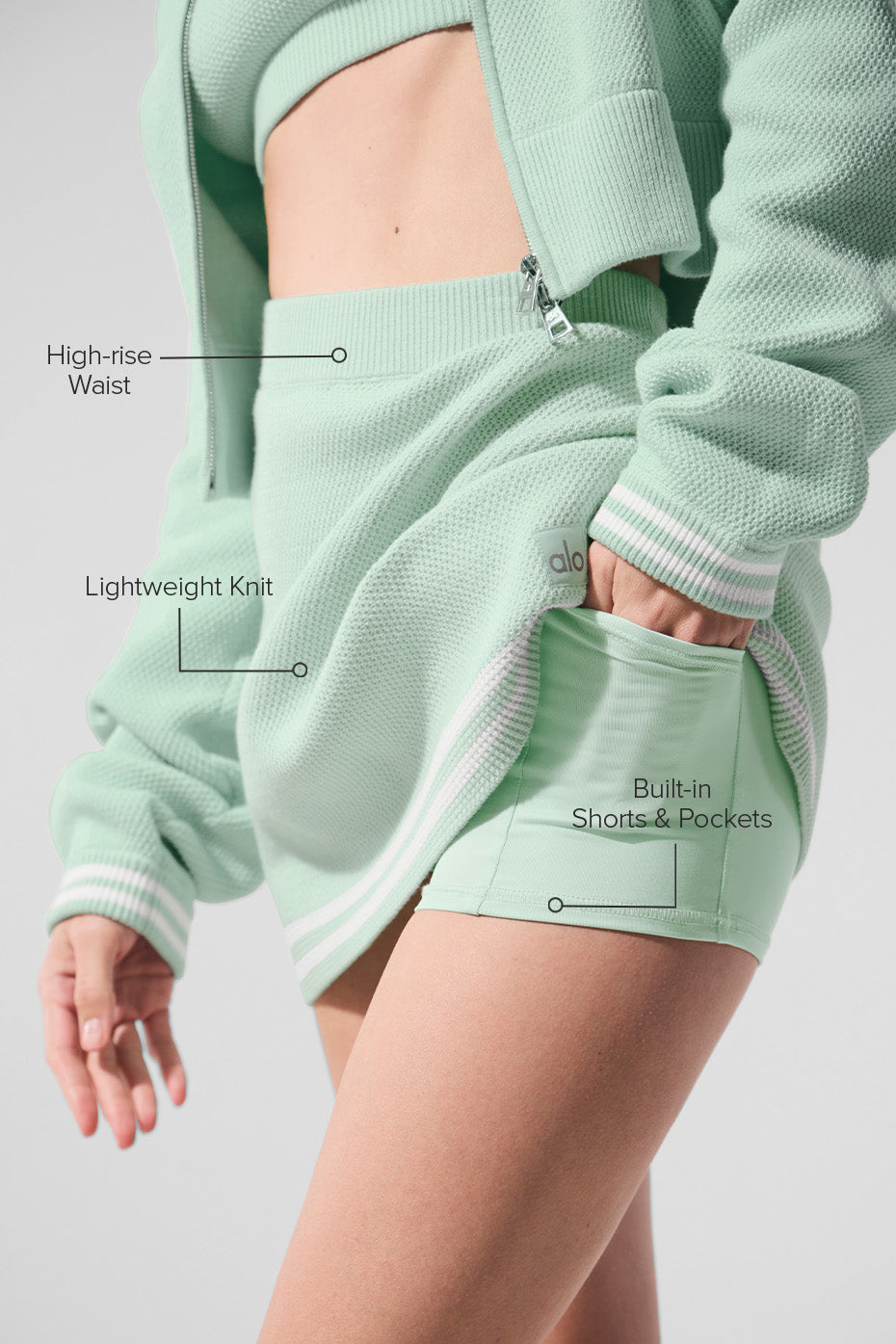 Close-up of the collegiate stripes on the spearmint and white tennis skirt.