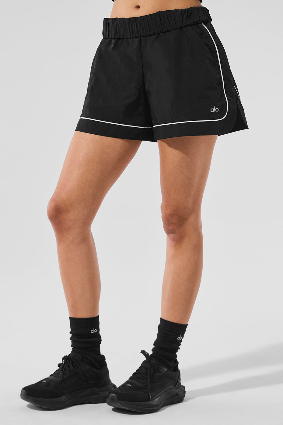 Detail shot of shorts’ zippered pocket and sporty fabric