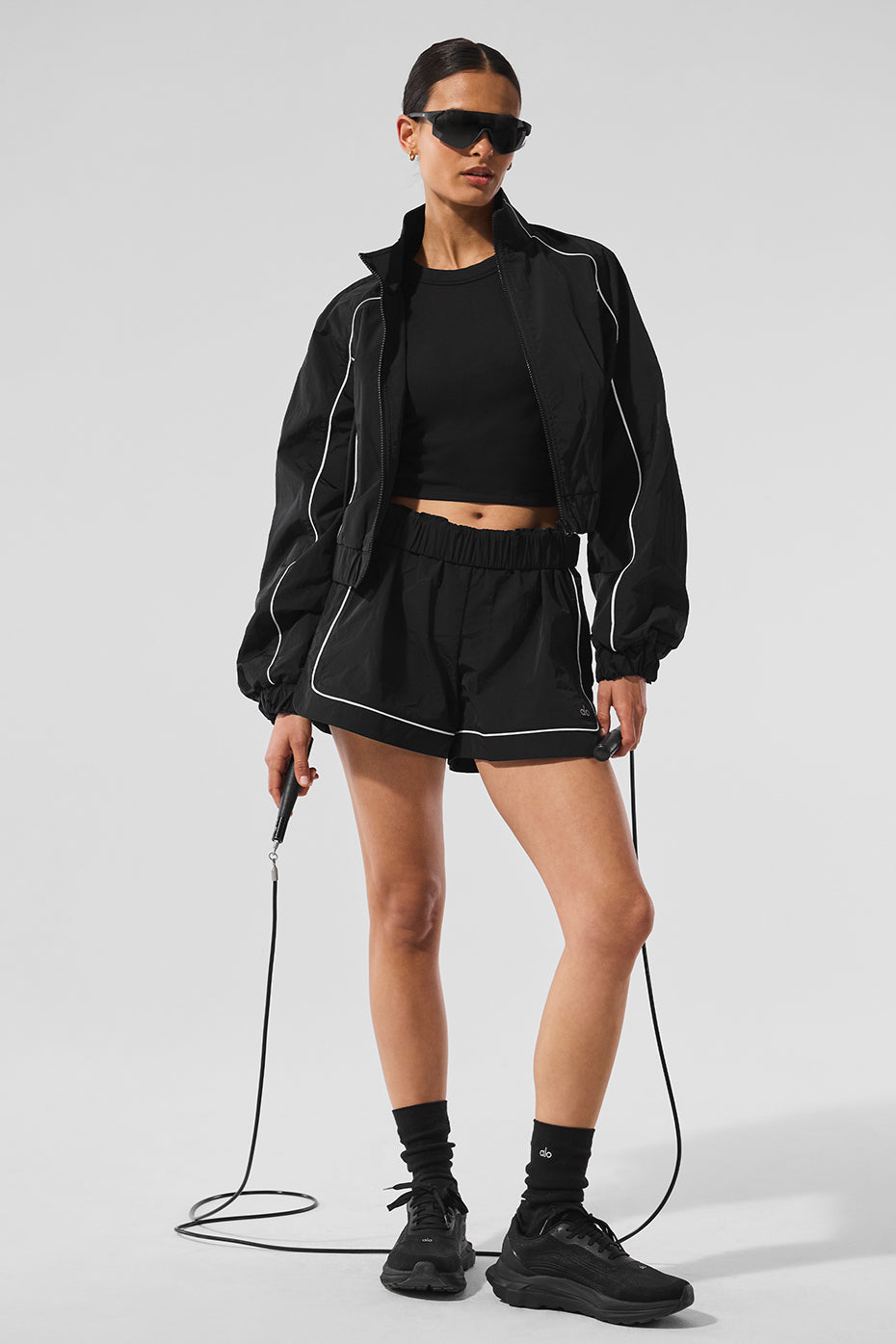 Model wearing performance shorts with zippered pockets for activewear
