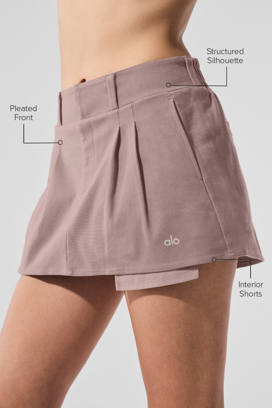 Side angle of the mushroom mini skirt paired with an oversized sweater.