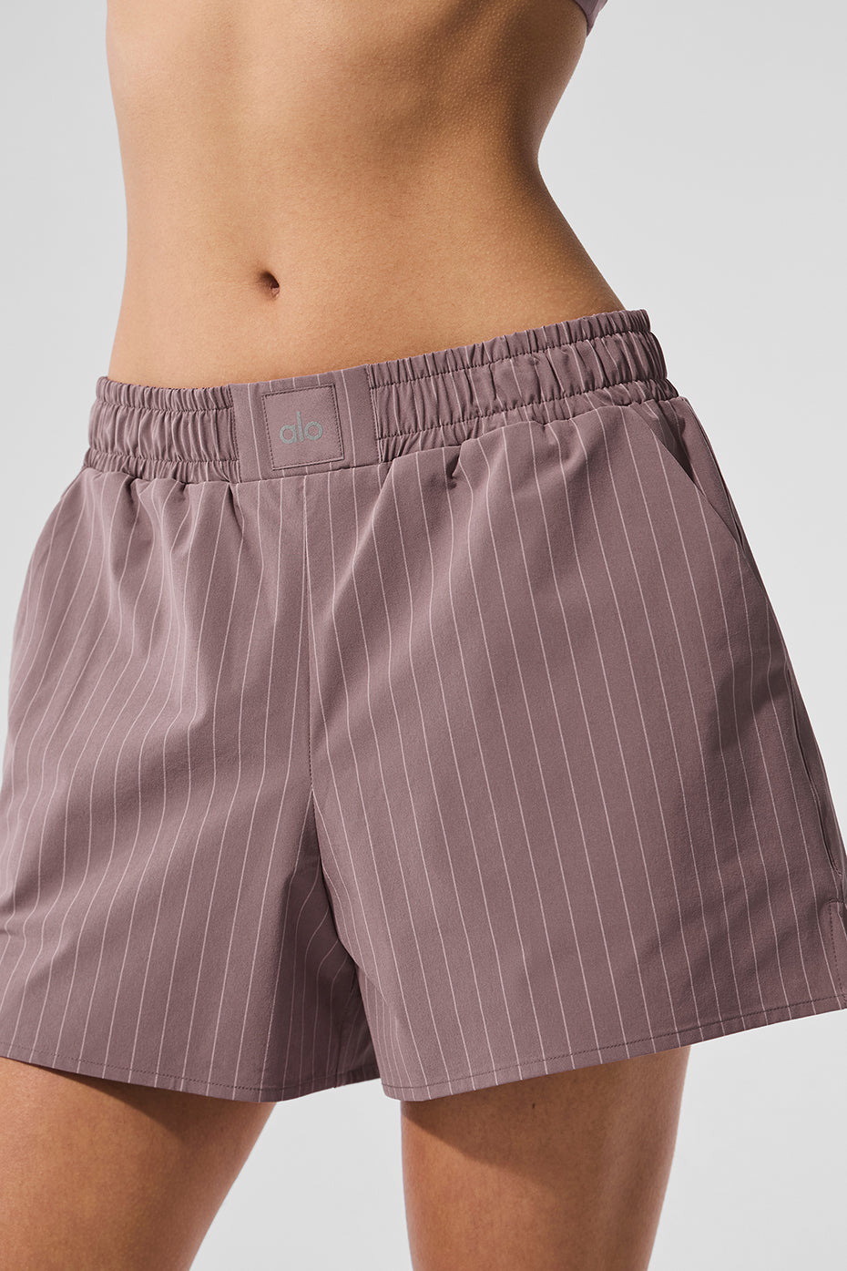 Close-up of mens underwear waistband showing subtle logo and pinstripe texture