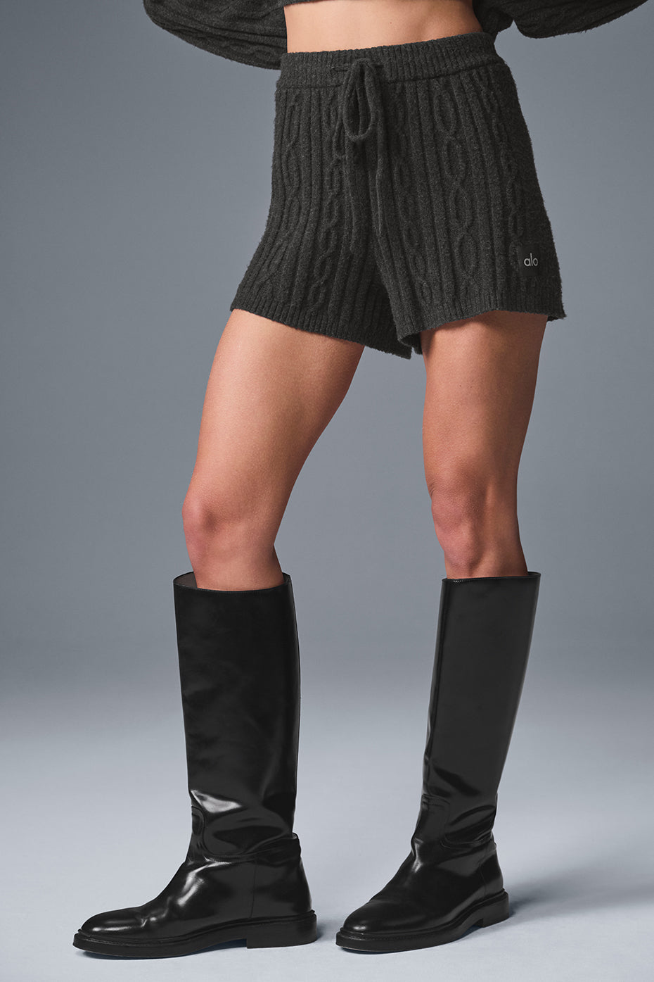 Front view of cozy cable knit winter shorts in dark heather grey.