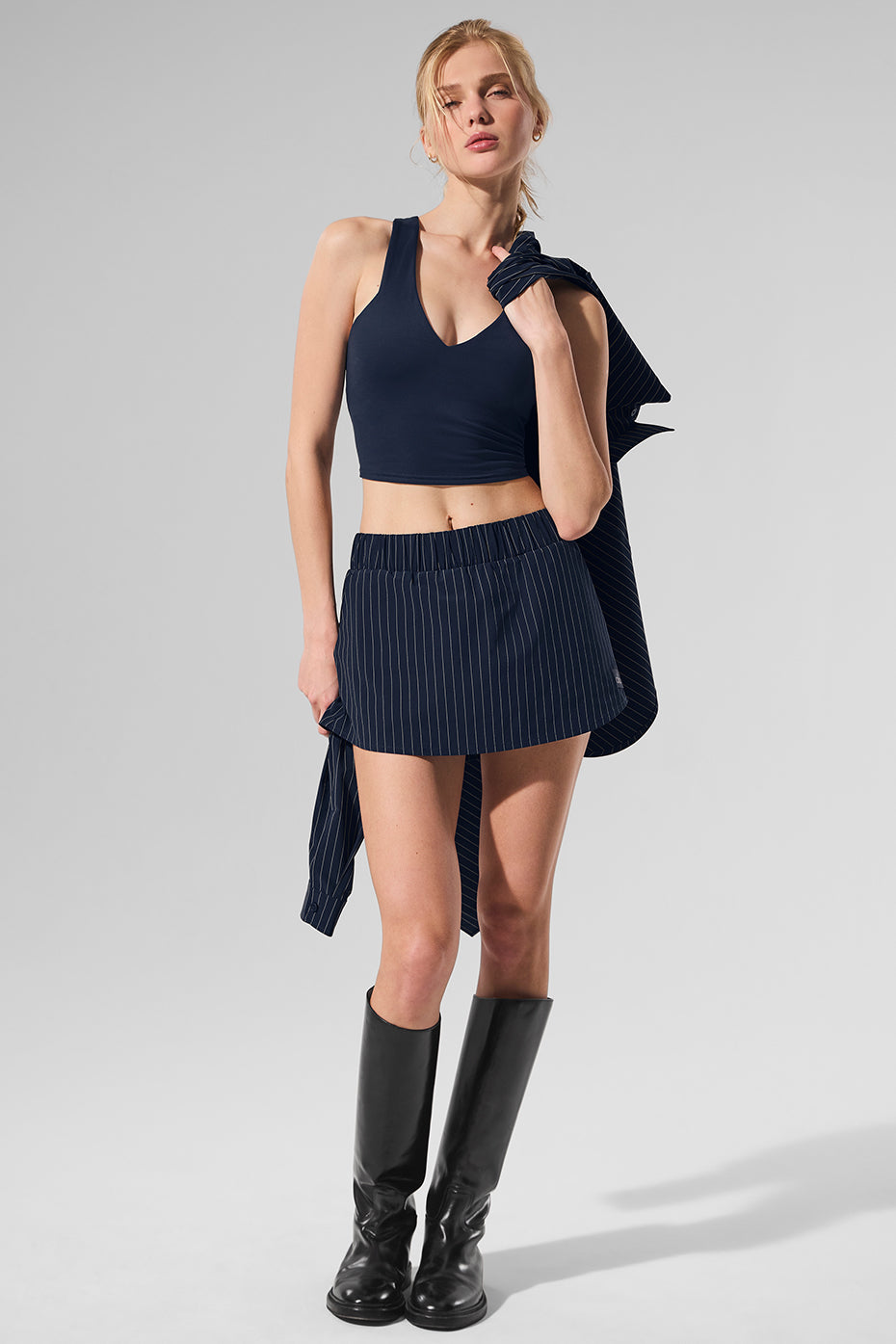 Close-up of lightweight pinstripe fabric detail on white mini skirt