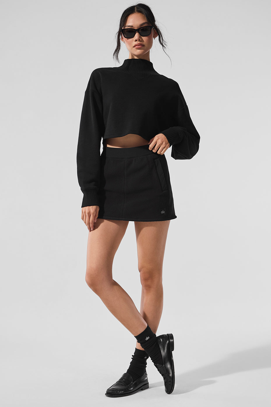 Front view of the chic black fleece winter skirt showcasing its soft texture.