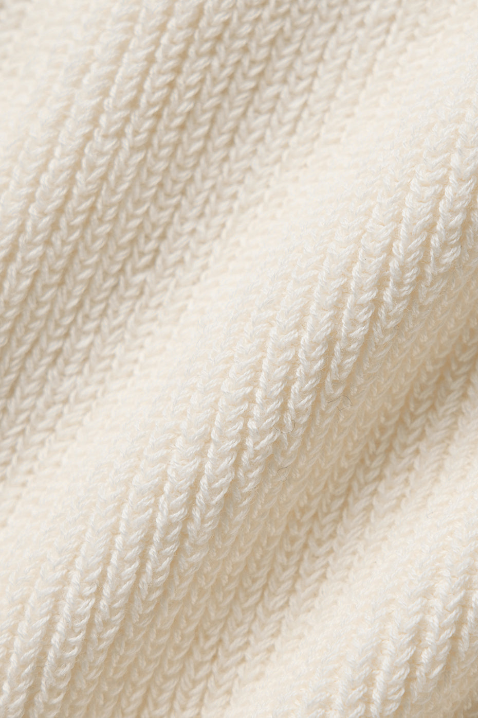 Close-up of the lightweight knit of the Ivory sweater shorts.