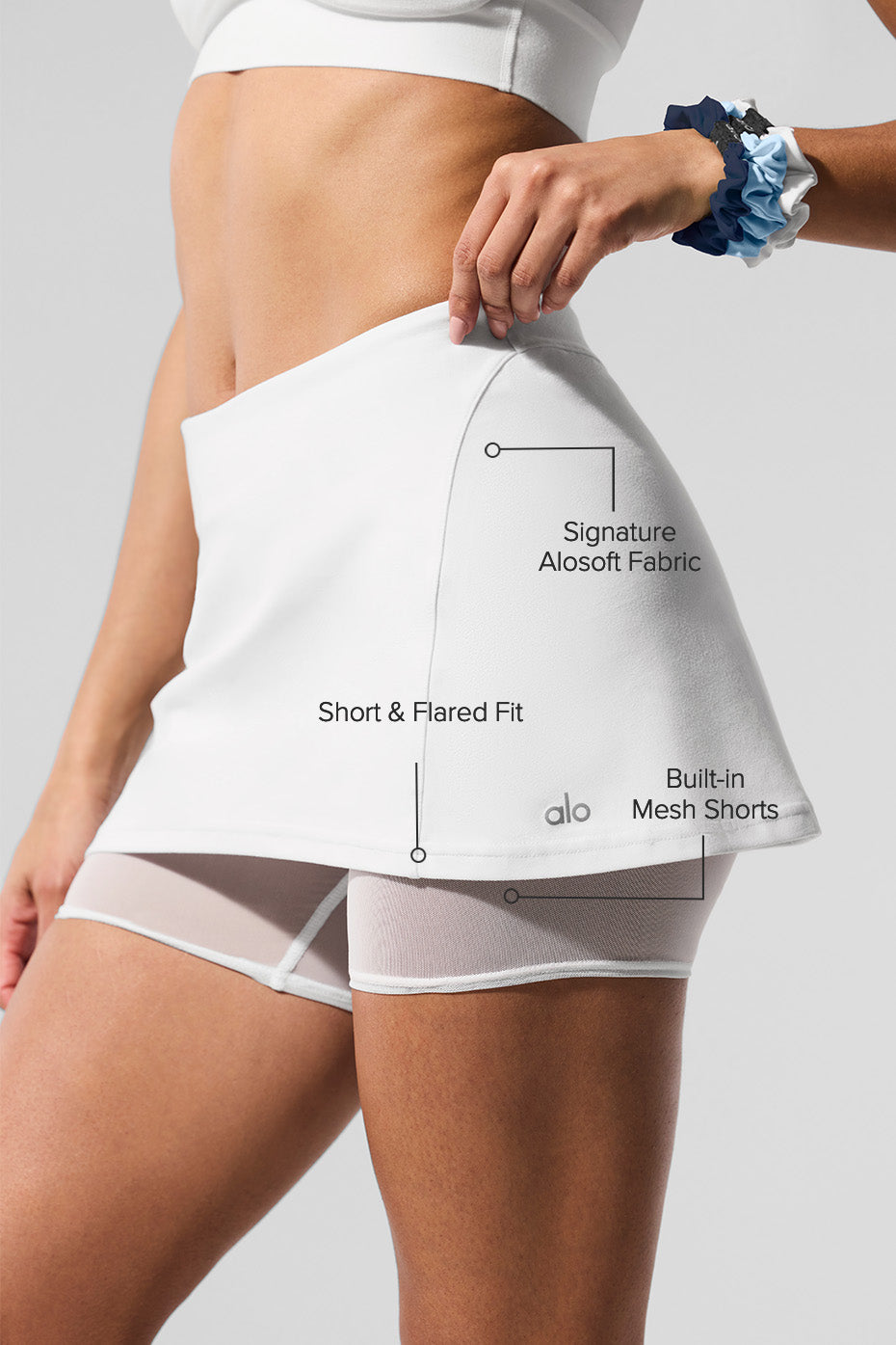 Side angle of the Alosoft Court Chic Skirt, highlighting the built-in mesh shorts.