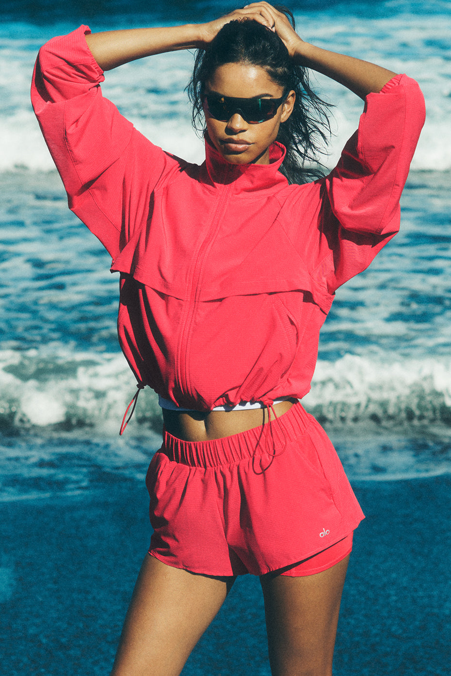 Front view of Sport Star Running Shorts in Candy Red, showcasing the flowy design.