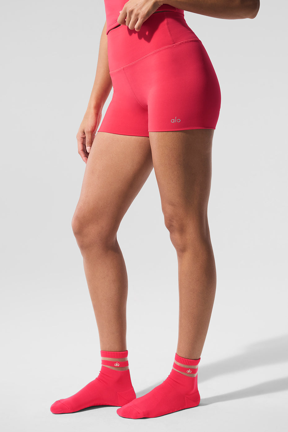 Side view showcasing the seamless hem of ALO performance shorts