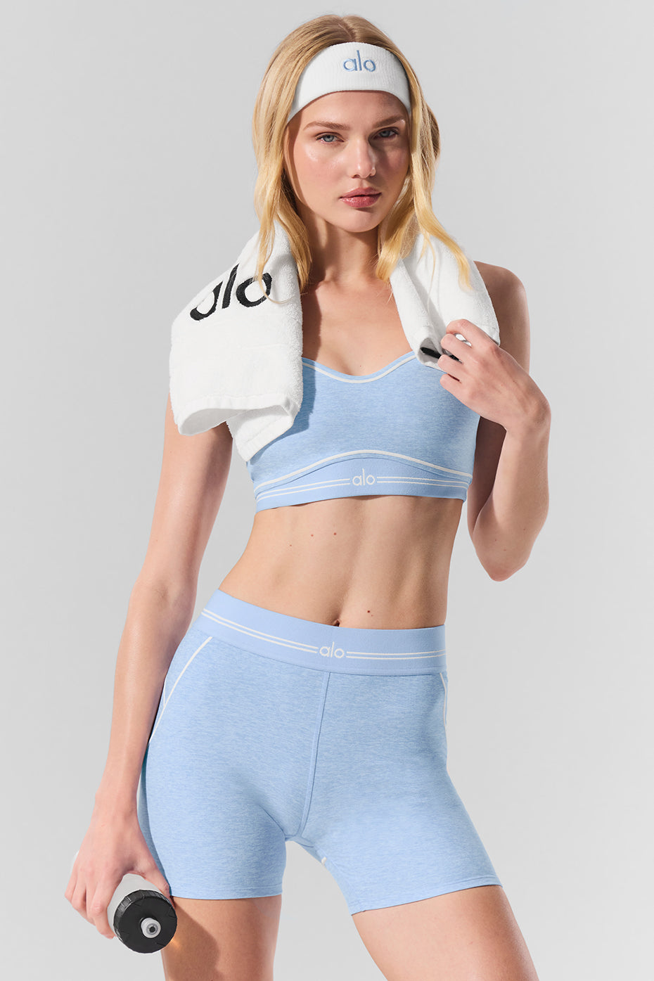Front view of high-waist shorts in seashell blue Heather with contrast piping