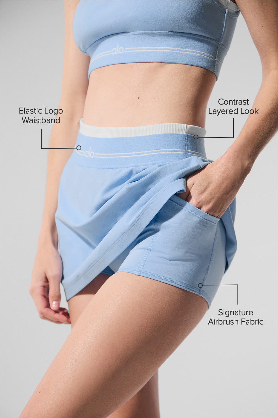 Close-up shot of the elastic waistband on the tennis skirt, showcasing logo detail