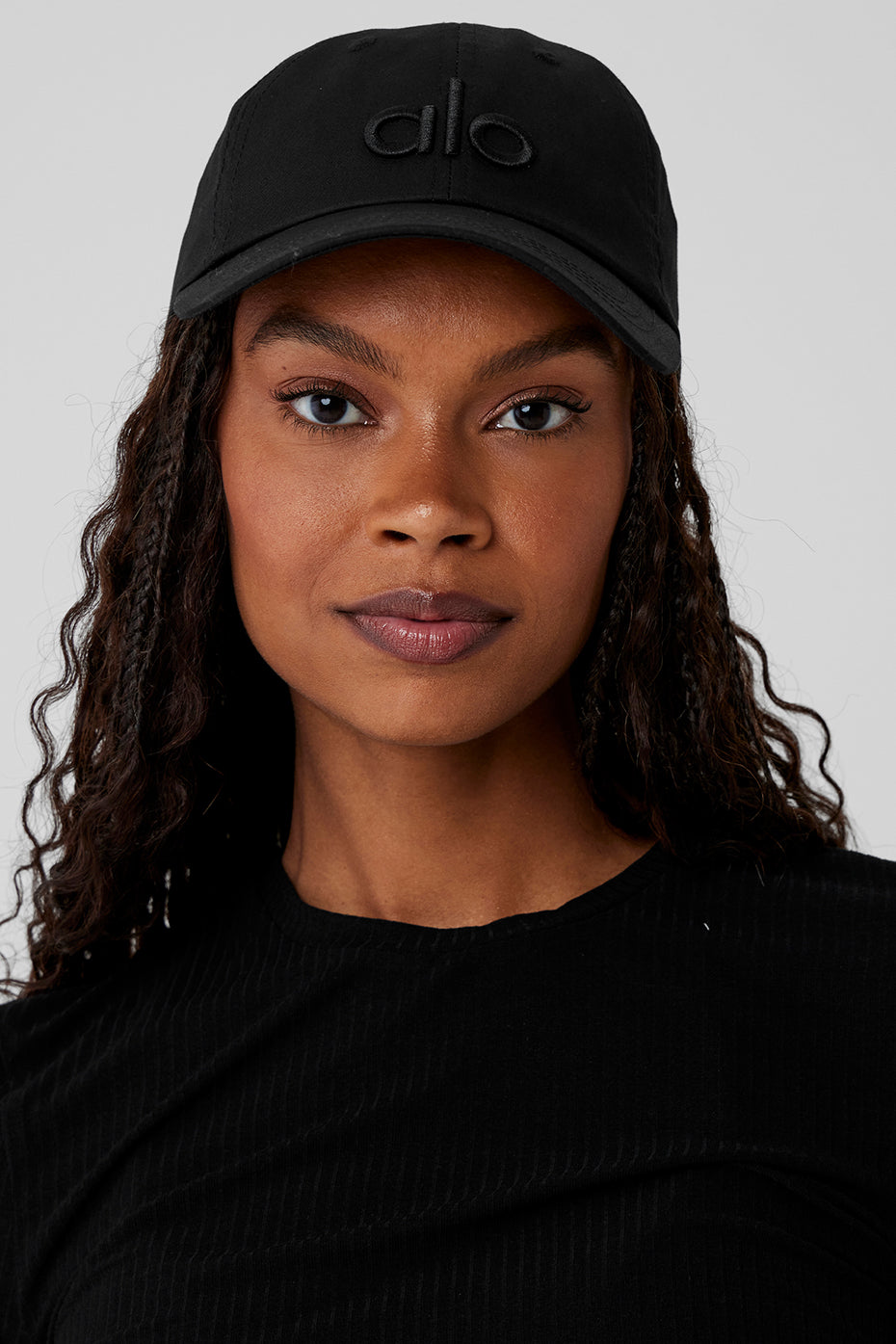 Close-up of mens black dad cap showing logo detail