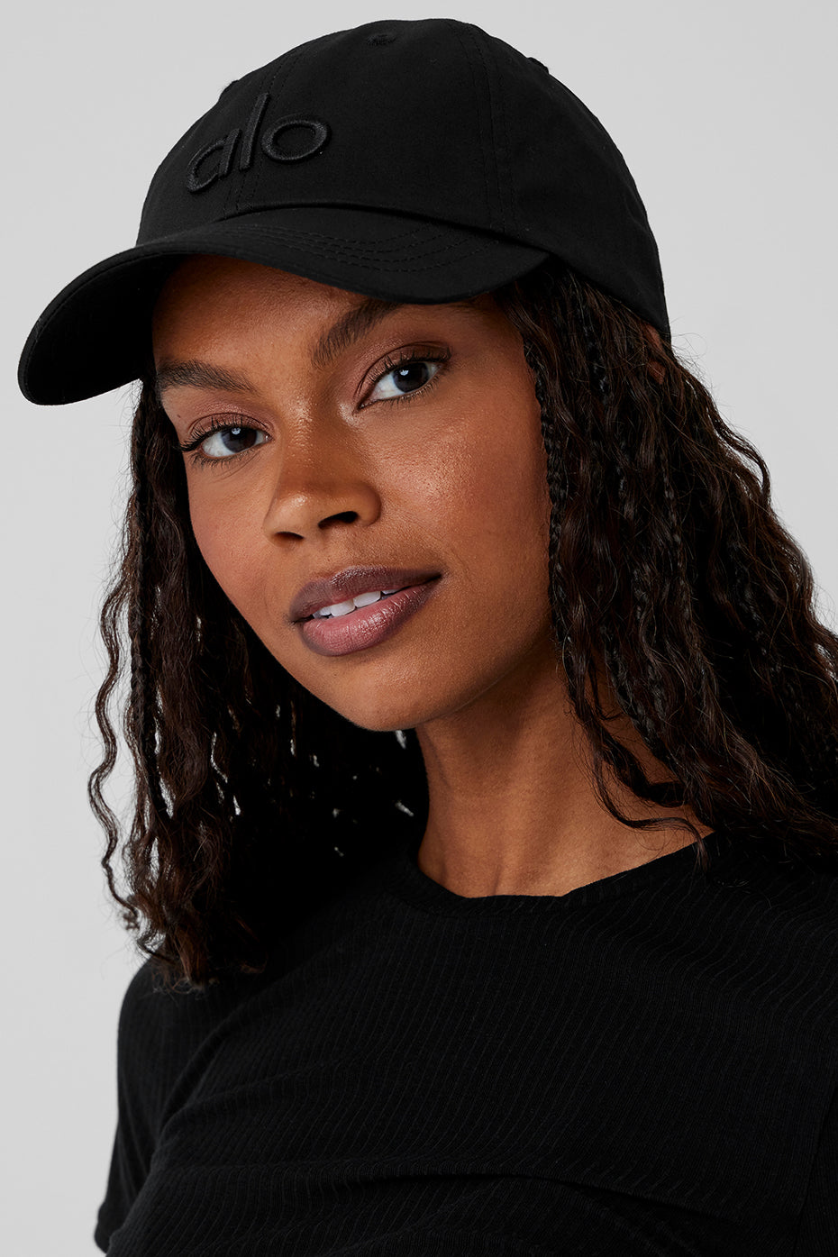 Side view of adjustable dad cap demonstrating velcro strap