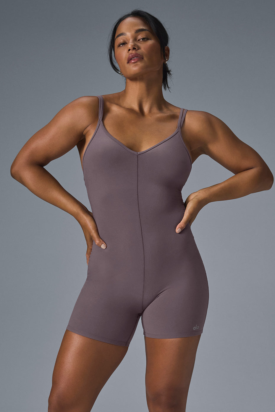Front view of the Suns Out Alosoft Onesie in Raisinette, showcasing the V-neck and double straps.
