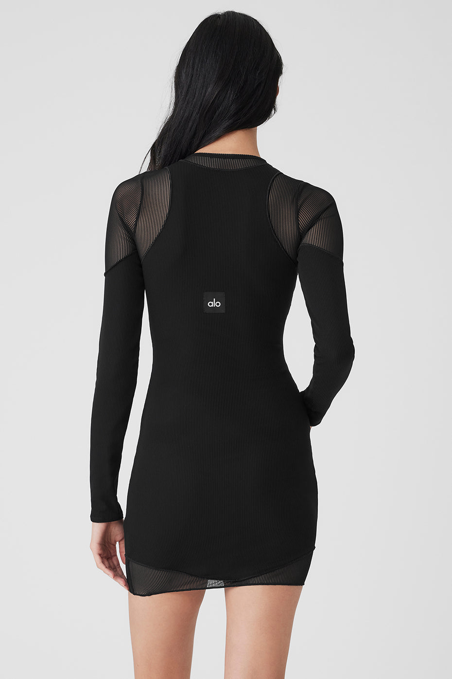 Side view showcasing the layered design of the long sleeve dress.