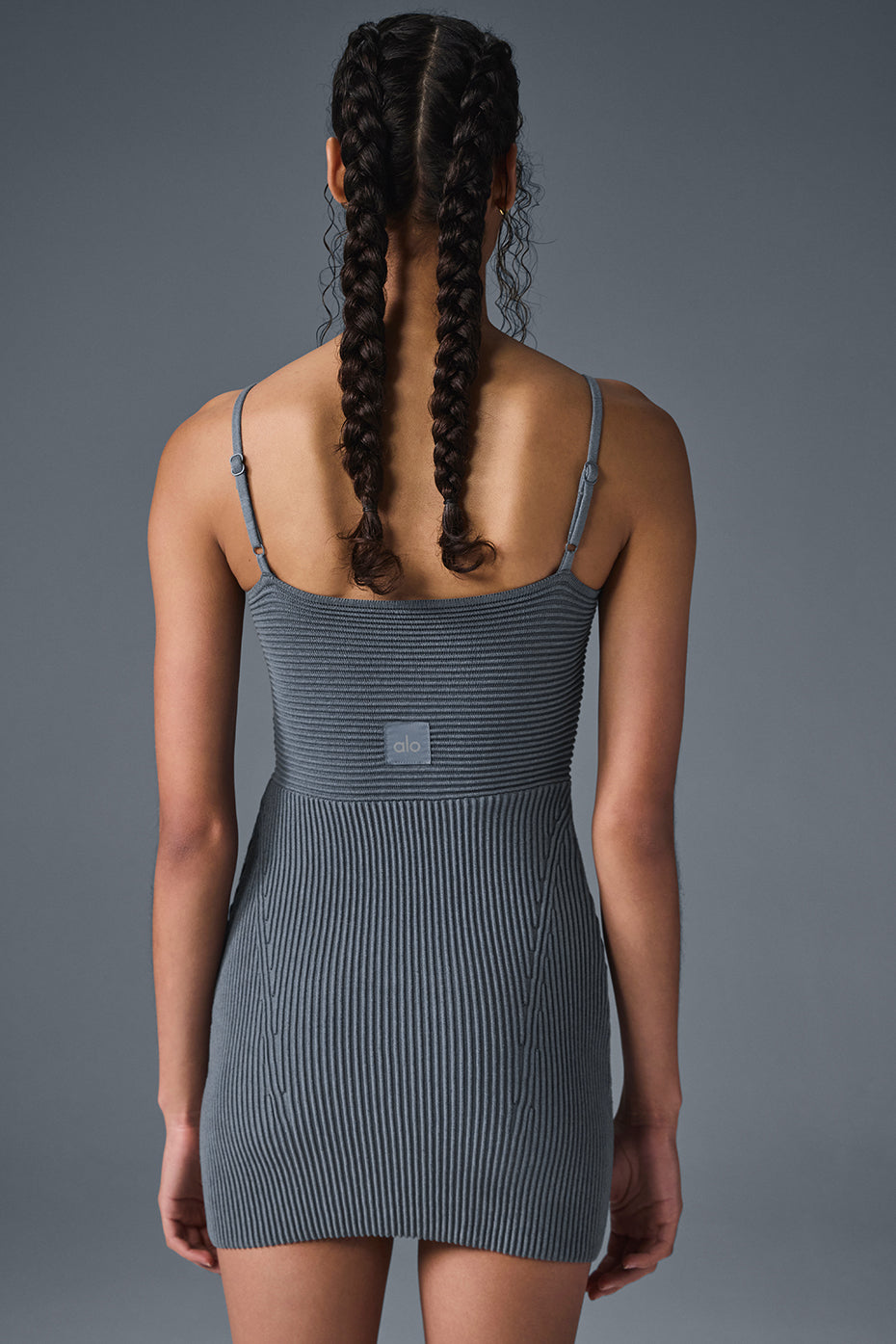 Close-up of the seamed detailing on the ribbed knit dress.