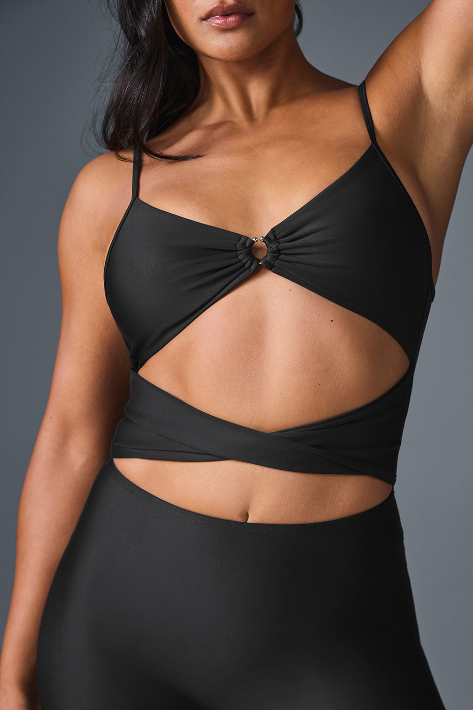 Front view of the Airlift A-List black jumpsuit showcasing cut-outs.