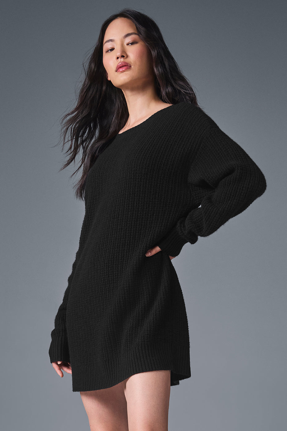 Front view of the luxe cashmere waffle dress in black, showcasing its elegant design.