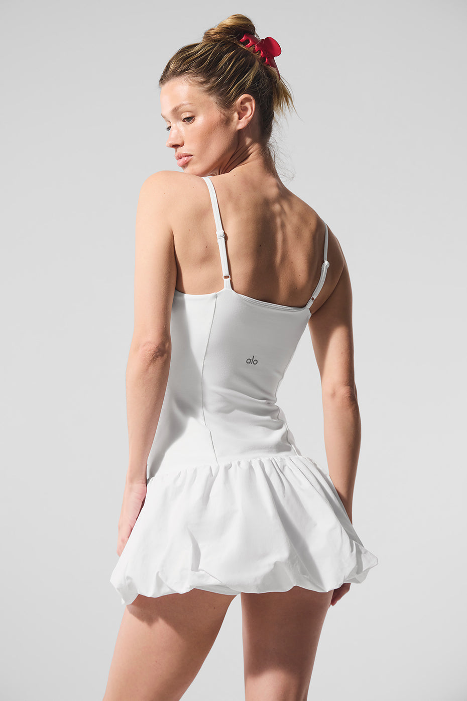 Front view of the white Airbrush Love Match tennis dress on a model.