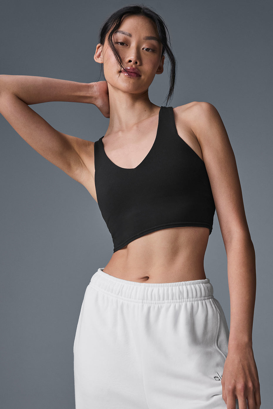 Model wearing the black tank top during a workout session.