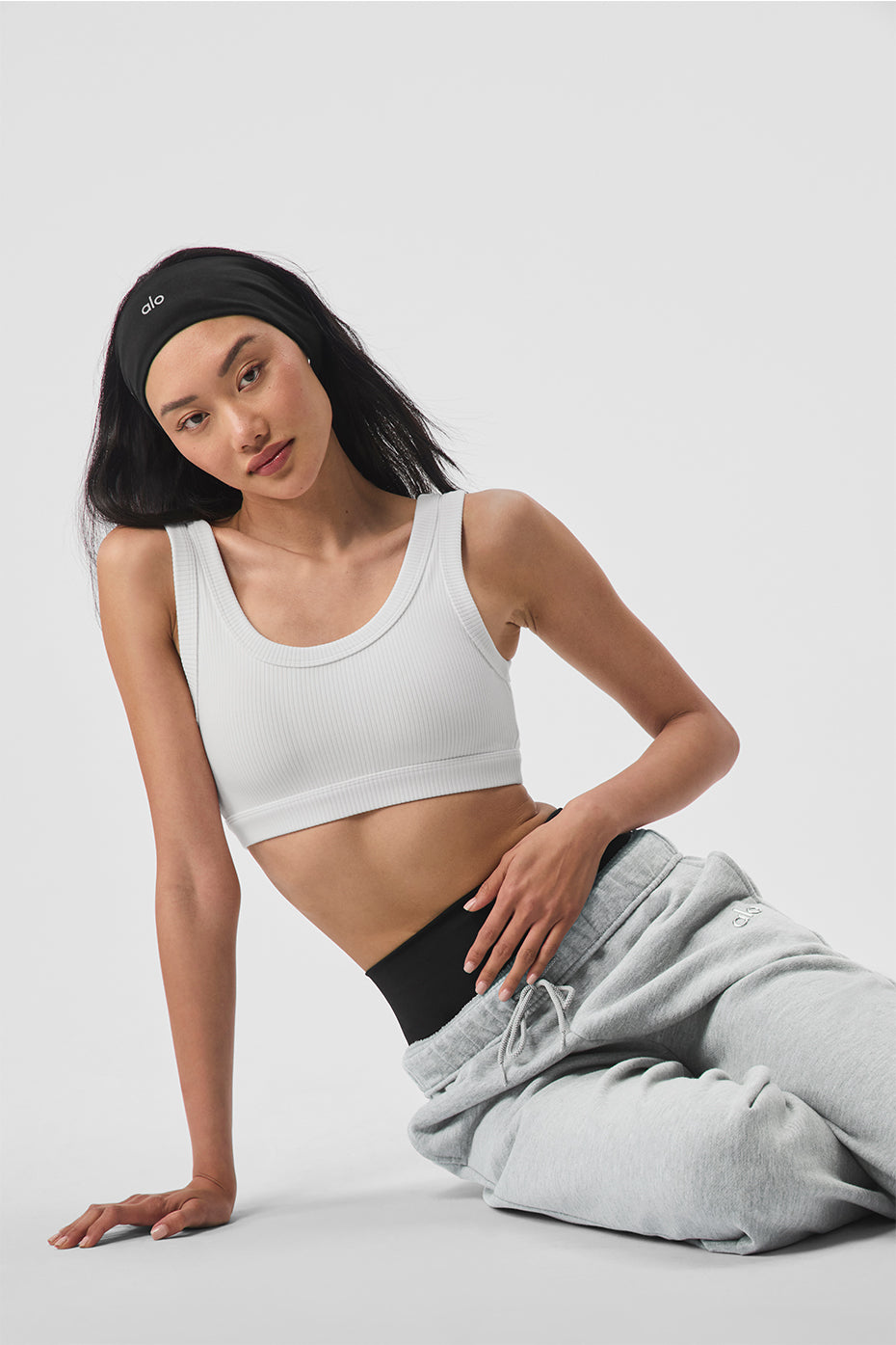 Front view of the Empower Activewear Bra in white, showcasing its scoop neck and wide straps.