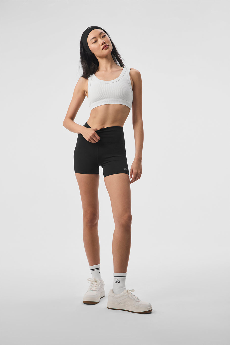 Model demonstrating the Empower Activewear Bra during a Pilates workout, showing its flexibility and support.