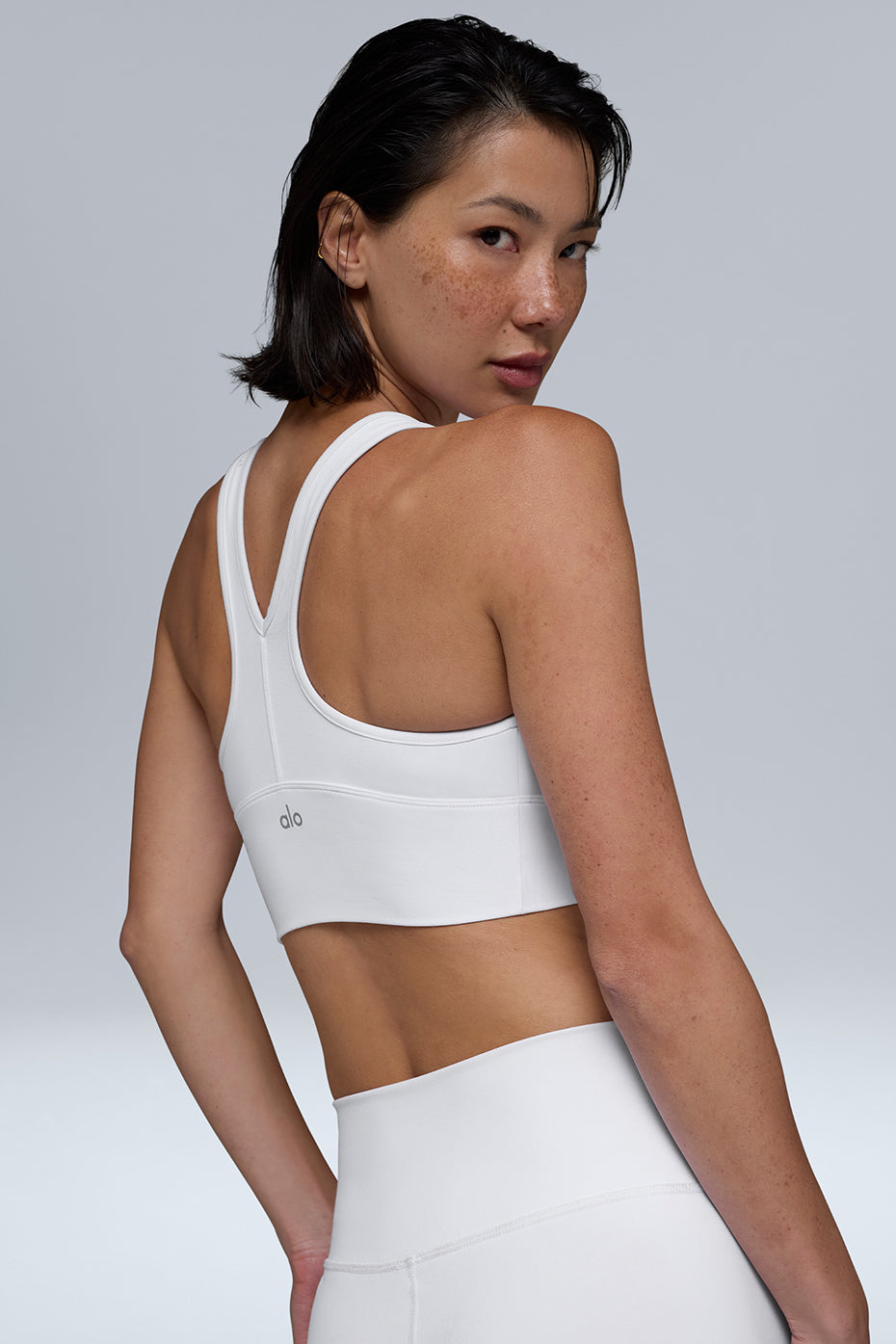 Model wearing the Wild Thing bra top crop top with leggings for activewear