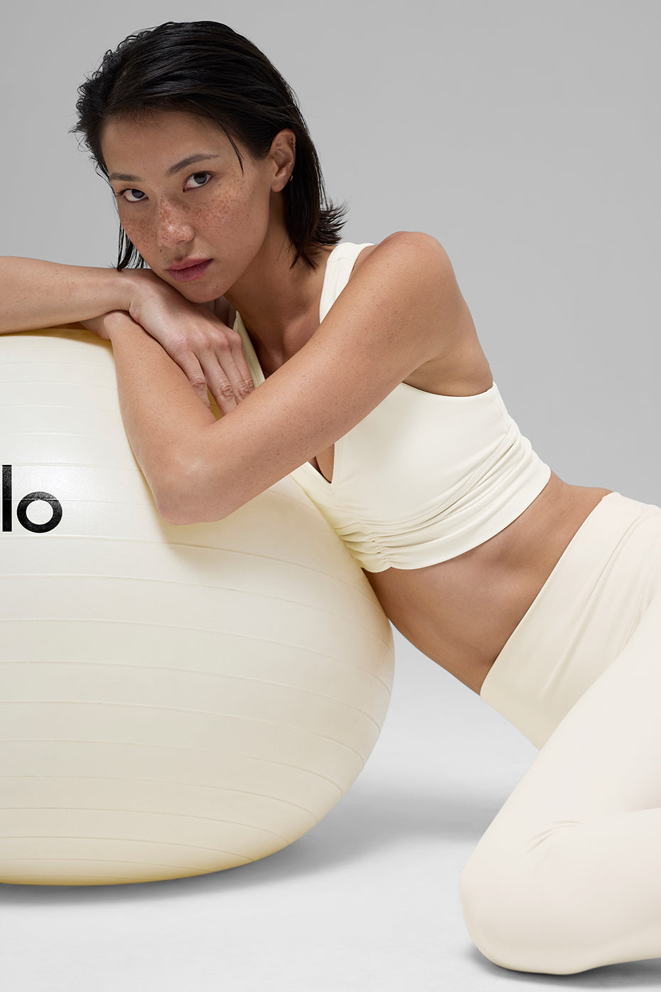 Front view of Wild Thing Crop Top Bra in ivory with stylish ruching.