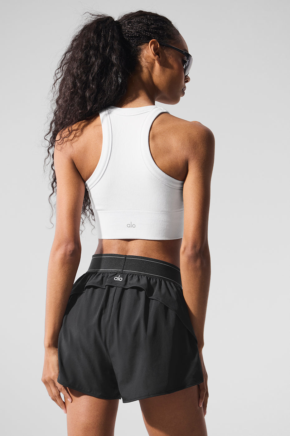 Model wearing the high neck bra during a yoga pose.