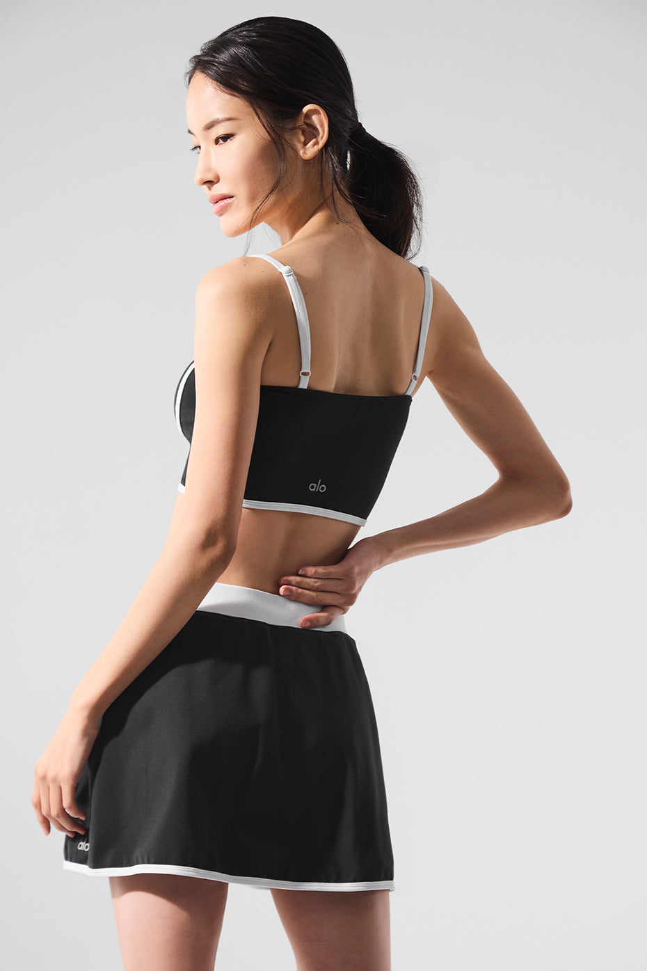 Styled image showing the tank top paired with high-waisted leggings for activewear or casual look