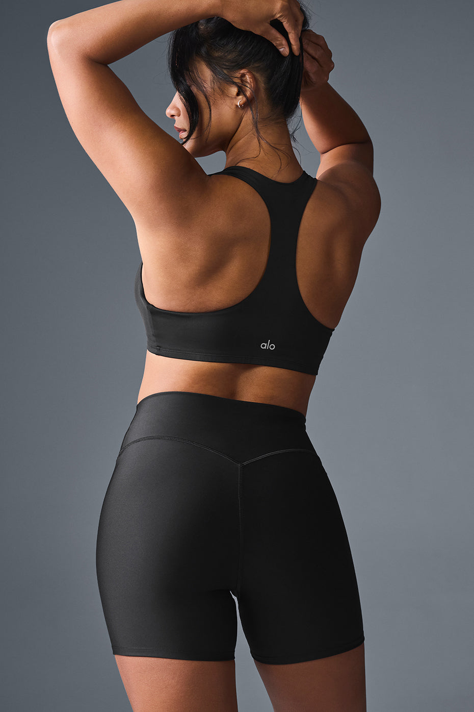 Model wearing the Airlift Advantage Wireless Racerback Bra during a yoga session.