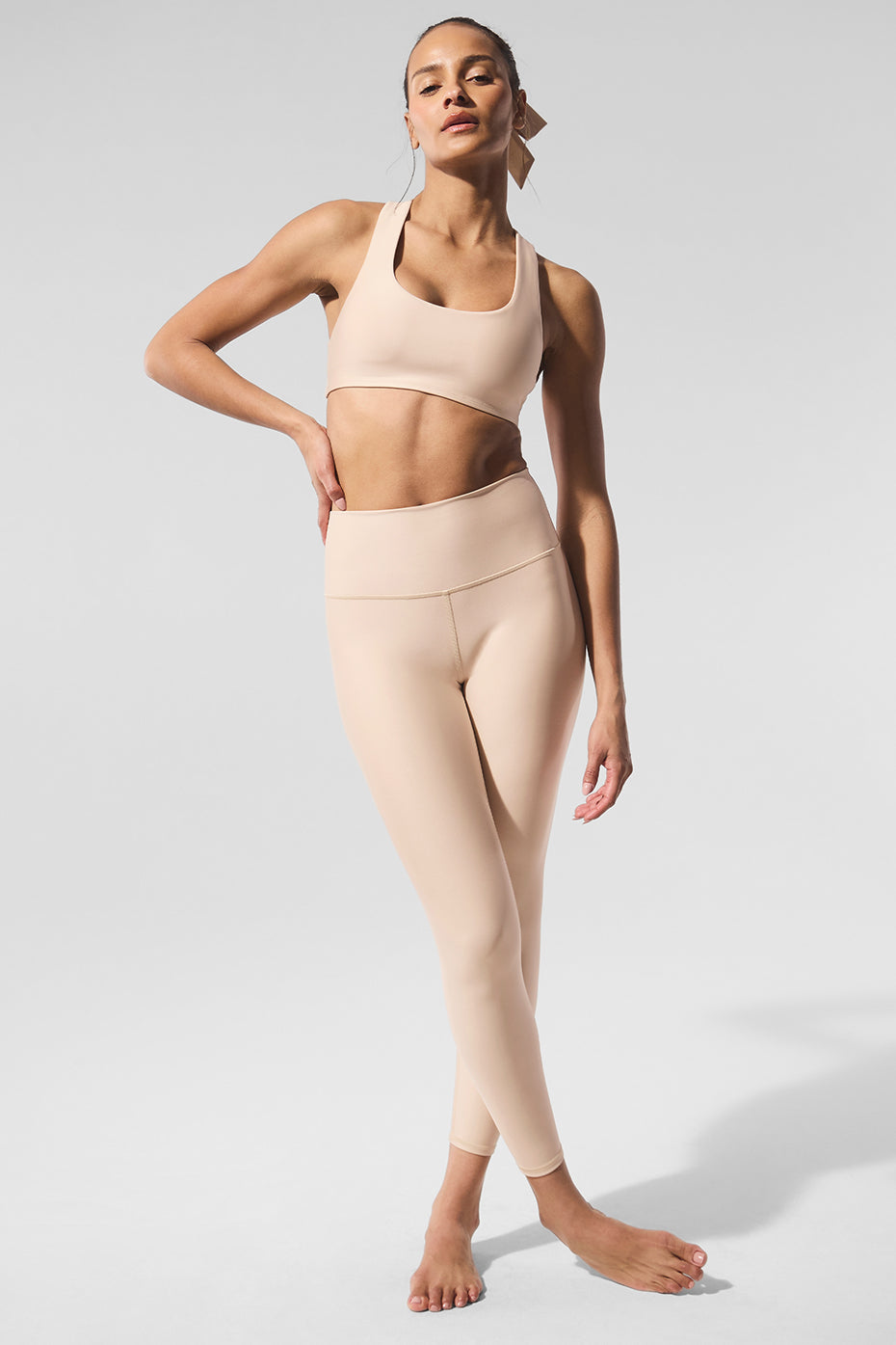 Side view showcasing the sleek design of the black racerback sports bra.