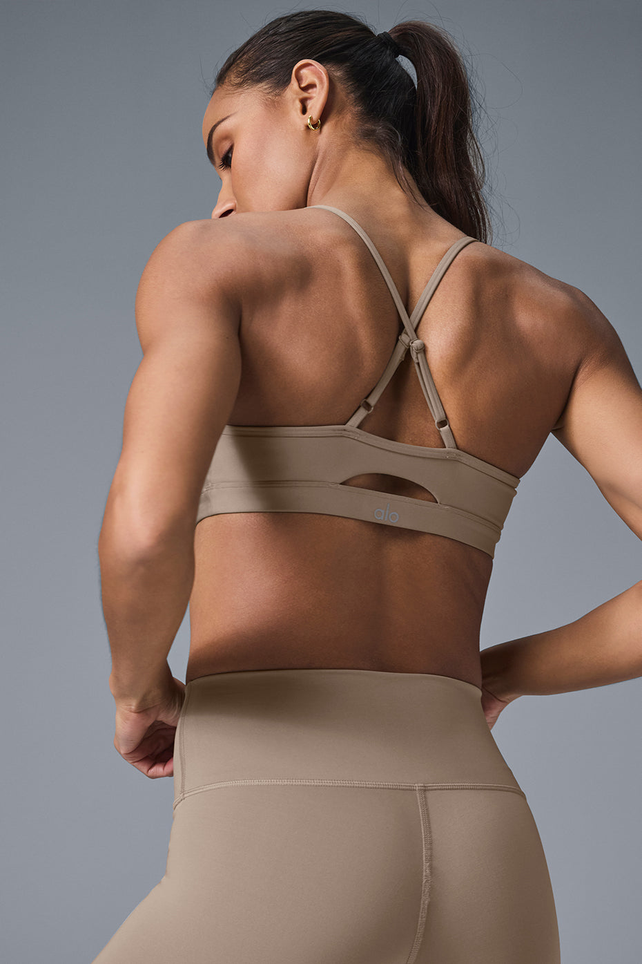Front view of the supportive sports bra with scoop neckline and keyhole cutout