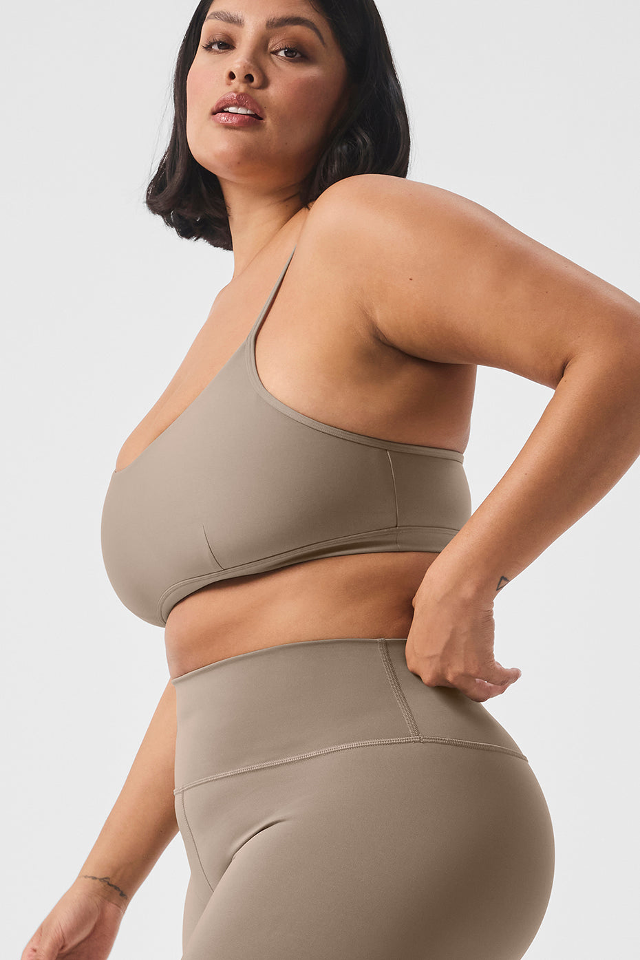 Front view of the supportive sports bra with scoop neckline and keyhole cutout